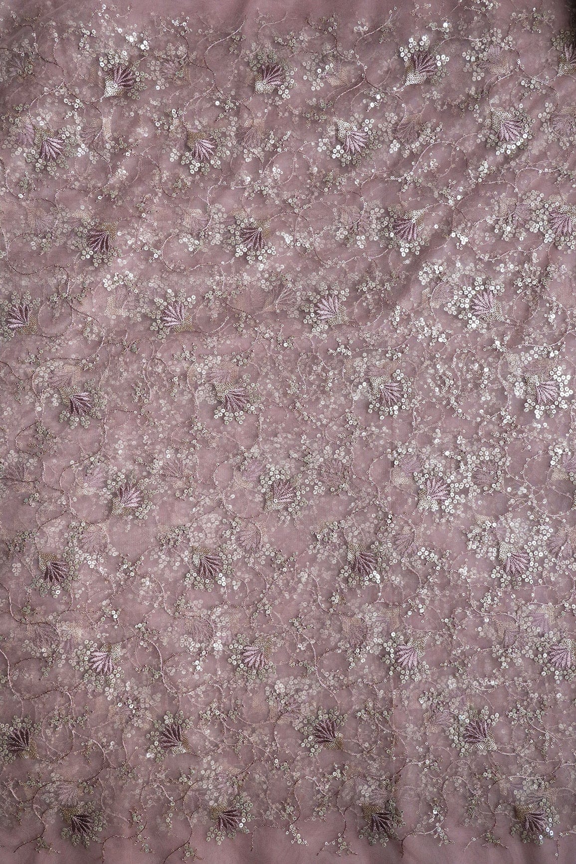 AIzaSyBcstauz-XMPRhEY21AUzeo032pxrXB5Ug - Gold And Silver Sequins With Mauve Thread Floral Embroidery Work On Mauve Soft Net Fabric