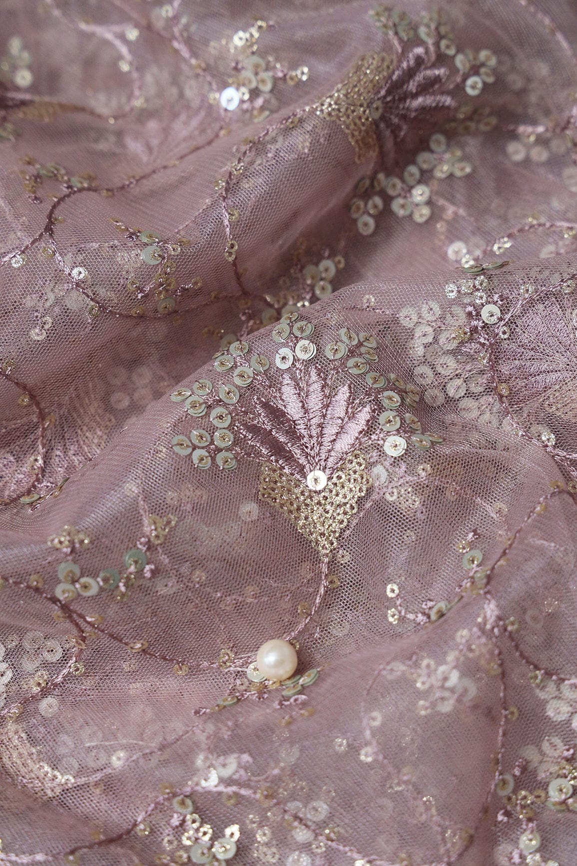 AIzaSyBcstauz-XMPRhEY21AUzeo032pxrXB5Ug - Gold And Silver Sequins With Mauve Thread Floral Embroidery Work On Mauve Soft Net Fabric