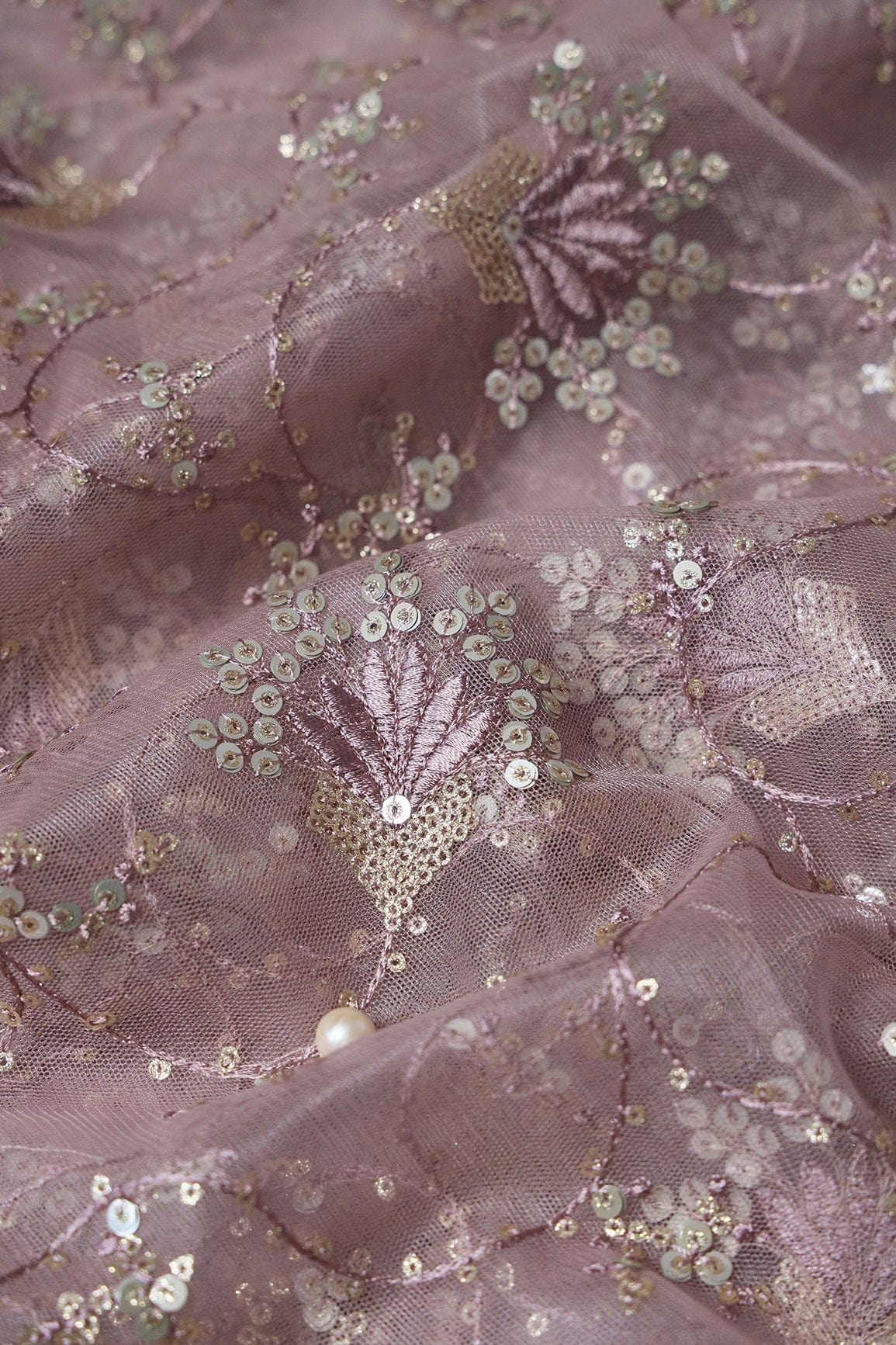 AIzaSyBcstauz-XMPRhEY21AUzeo032pxrXB5Ug - Gold And Silver Sequins With Mauve Thread Floral Embroidery Work On Mauve Soft Net Fabric