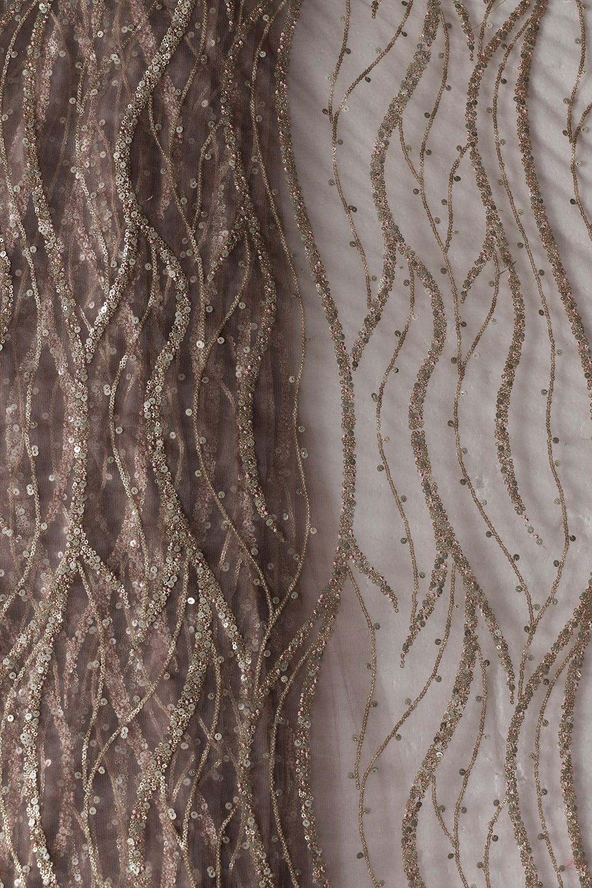 AIzaSyBcstauz-XMPRhEY21AUzeo032pxrXB5Ug - Gold And Silver Sequins With Mauve Thread Wavy Embroidery Work On Mauve Soft Net Fabric