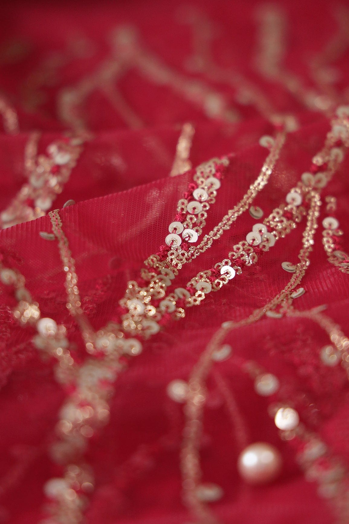 AIzaSyBcstauz-XMPRhEY21AUzeo032pxrXB5Ug - Gold And Silver Sequins With Red Thread Wavy Embroidery Work On Cherry Red Soft Net Fabric