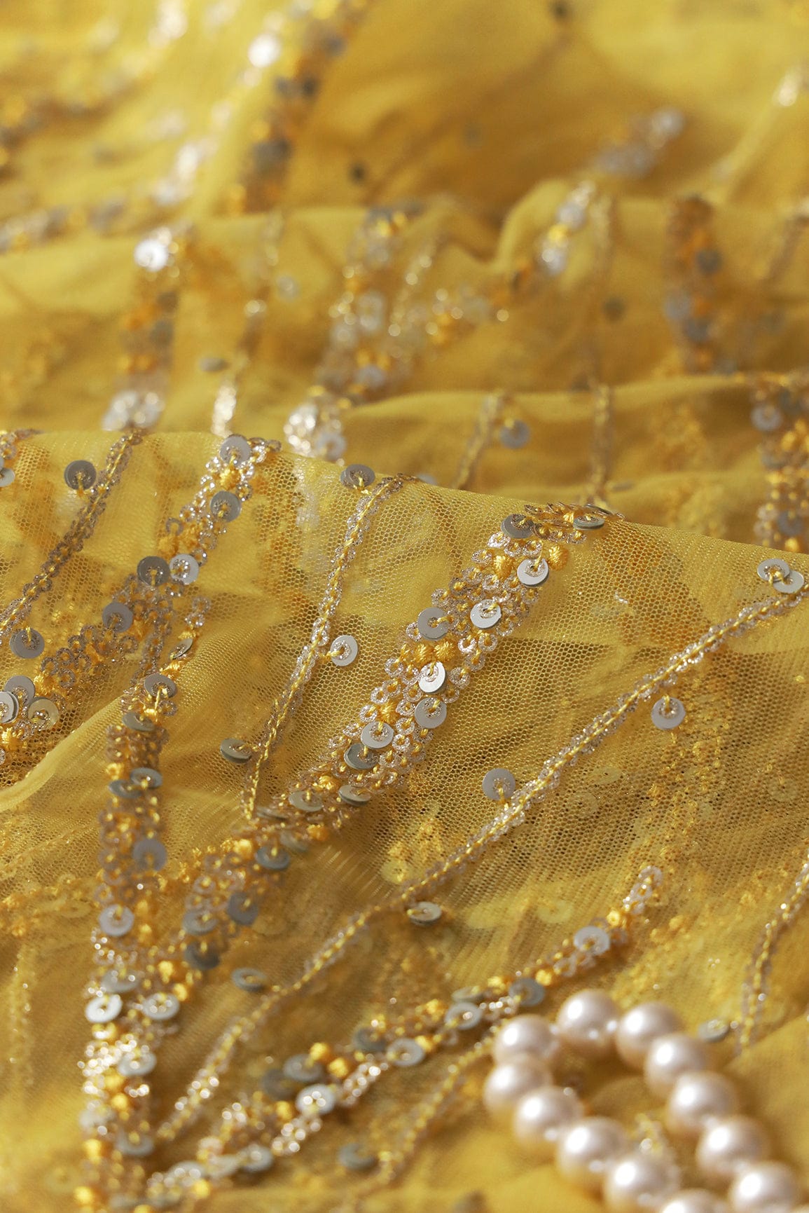 AIzaSyBcstauz-XMPRhEY21AUzeo032pxrXB5Ug - Gold And Silver Sequins With yellow Thread Wavy Embroidery Work On yellow Soft Net Fabric