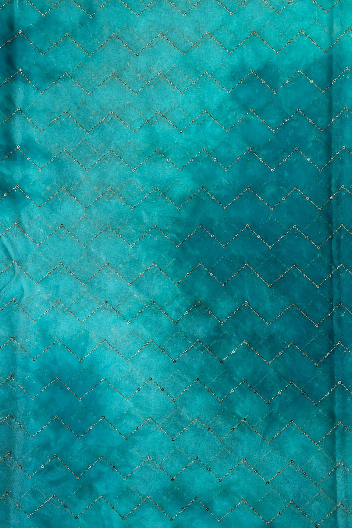 AIzaSyBcstauz-XMPRhEY21AUzeo032pxrXB5Ug - Gold Sequins Chevron Embroidery Work On Tie & Dye Rama Organza Fabric