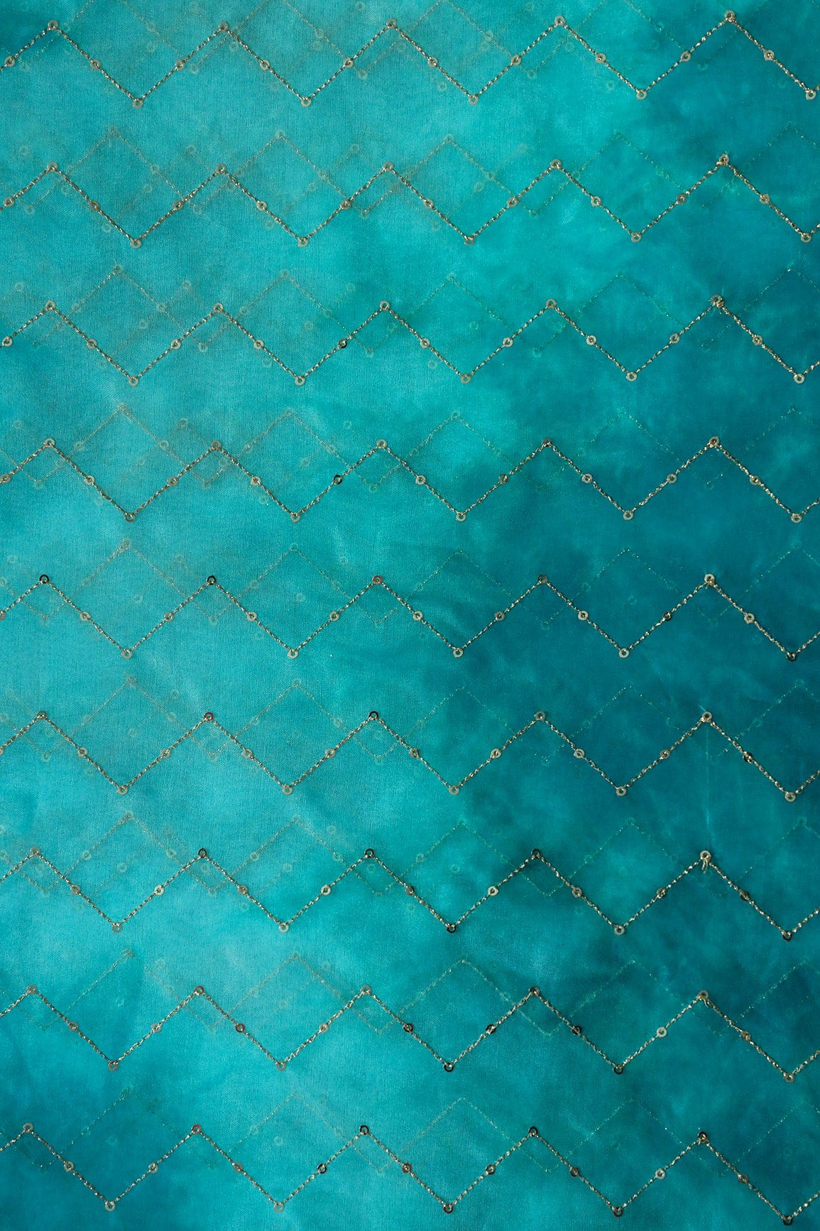 AIzaSyBcstauz-XMPRhEY21AUzeo032pxrXB5Ug - Gold Sequins Chevron Embroidery Work On Tie & Dye Rama Organza Fabric