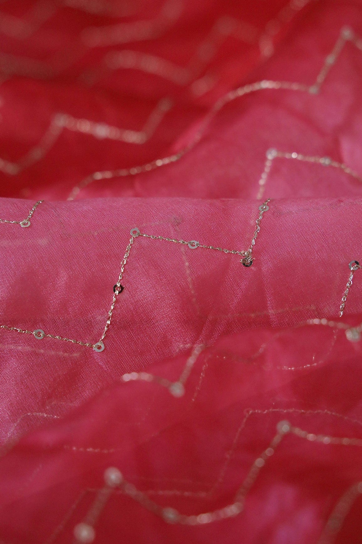 AIzaSyBcstauz-XMPRhEY21AUzeo032pxrXB5Ug - Gold Sequins Chevron Embroidery Work On Tie & Dye Red Organza Fabric