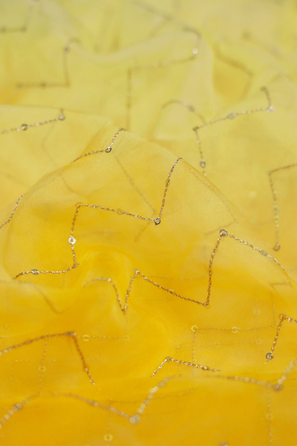 AIzaSyBcstauz-XMPRhEY21AUzeo032pxrXB5Ug - Gold Sequins Chevron Embroidery Work On Tie & Dye Yellow Organza Fabric