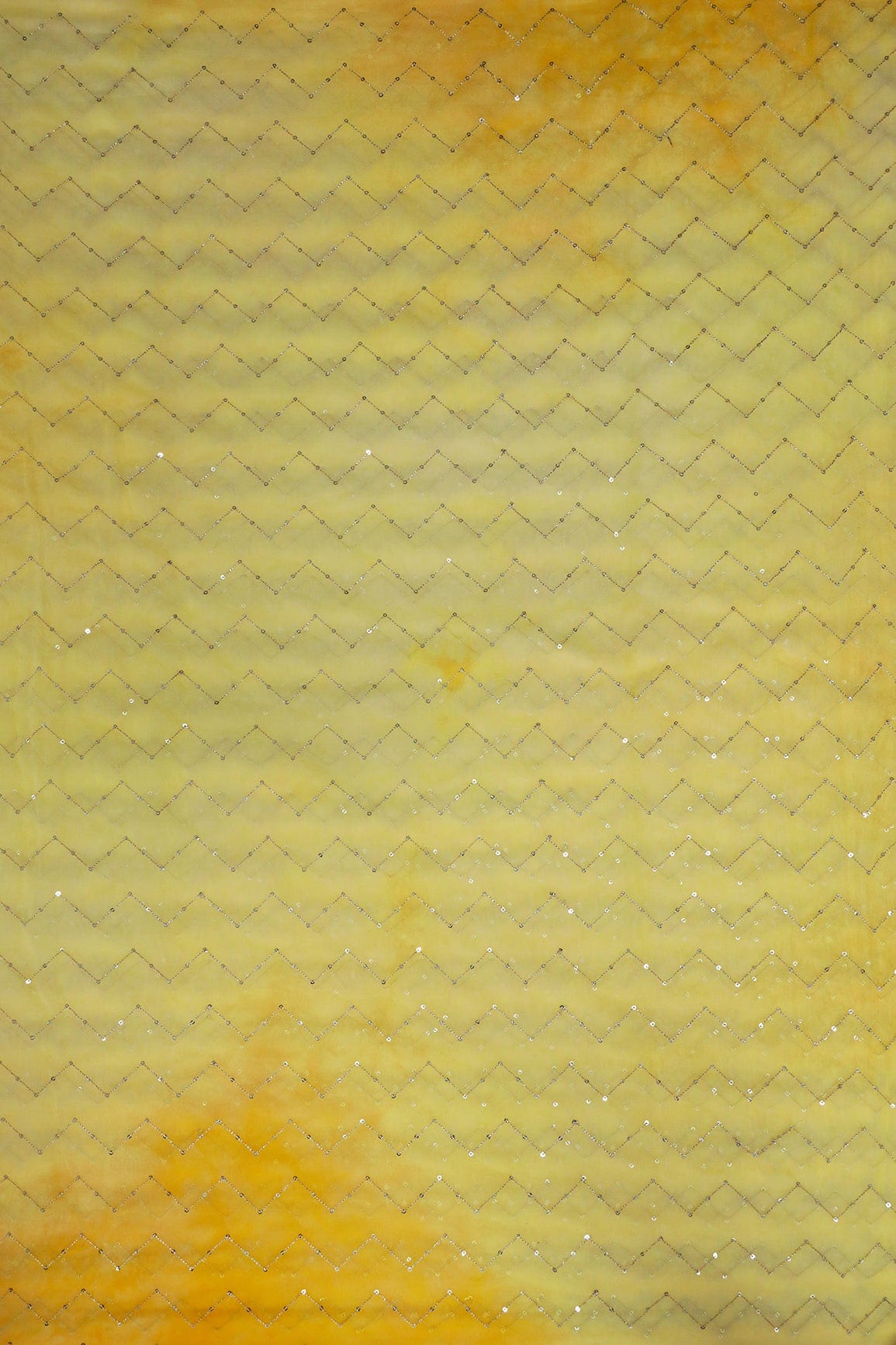 AIzaSyBcstauz-XMPRhEY21AUzeo032pxrXB5Ug - Gold Sequins Chevron Embroidery Work On Tie & Dye Yellow Organza Fabric