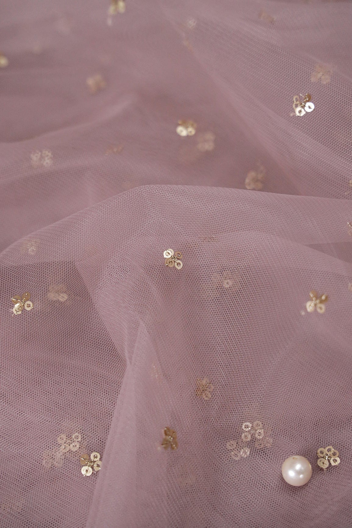 AIzaSyBcstauz-XMPRhEY21AUzeo032pxrXB5Ug - Gold Sequins Small Motif Embroidery Work On Mauve Soft Net Fabric