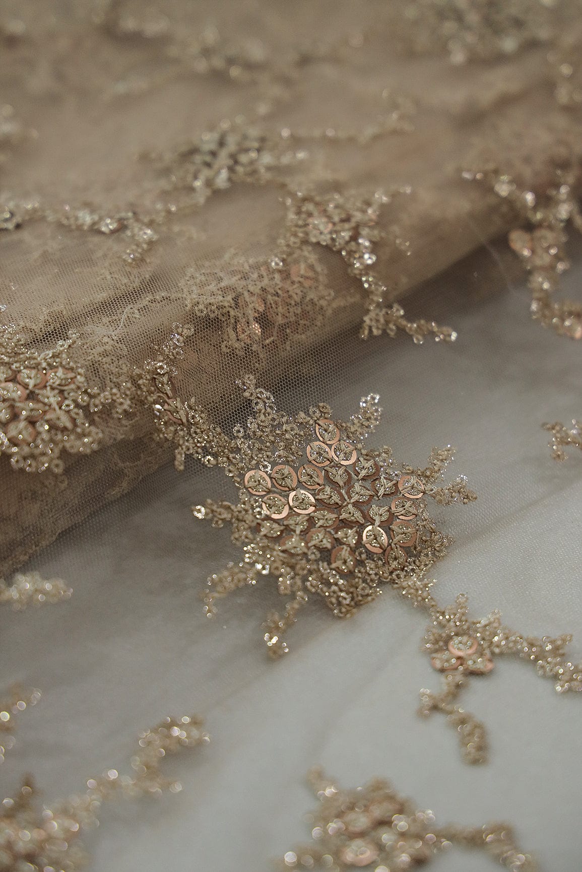 AIzaSyBcstauz-XMPRhEY21AUzeo032pxrXB5Ug - Gold Sequins with Beige Thread Work Embroidery On Beige Soft Net Fabric