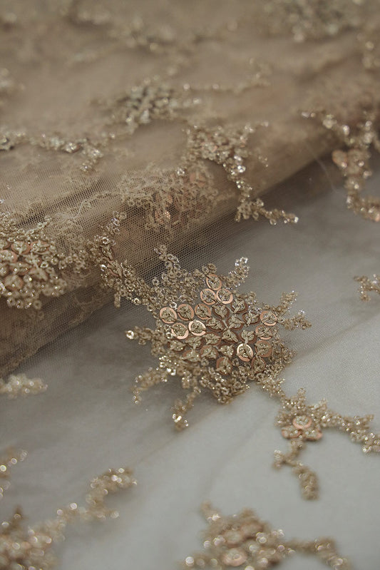 AIzaSyBcstauz-XMPRhEY21AUzeo032pxrXB5Ug - Gold Sequins with Beige Thread Work Embroidery On Beige Soft Net Fabric