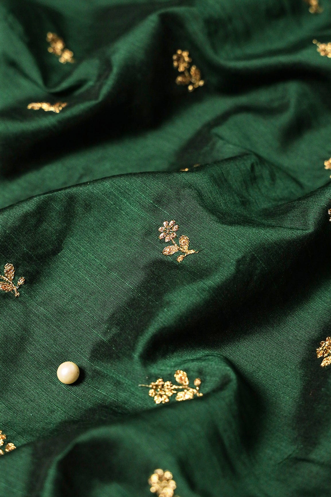 AIzaSyBcstauz-XMPRhEY21AUzeo032pxrXB5Ug - Gold Sequins With Gold Zari Small Floral Motif Embroidery Work On Bottle Green Raw Silk Fabric