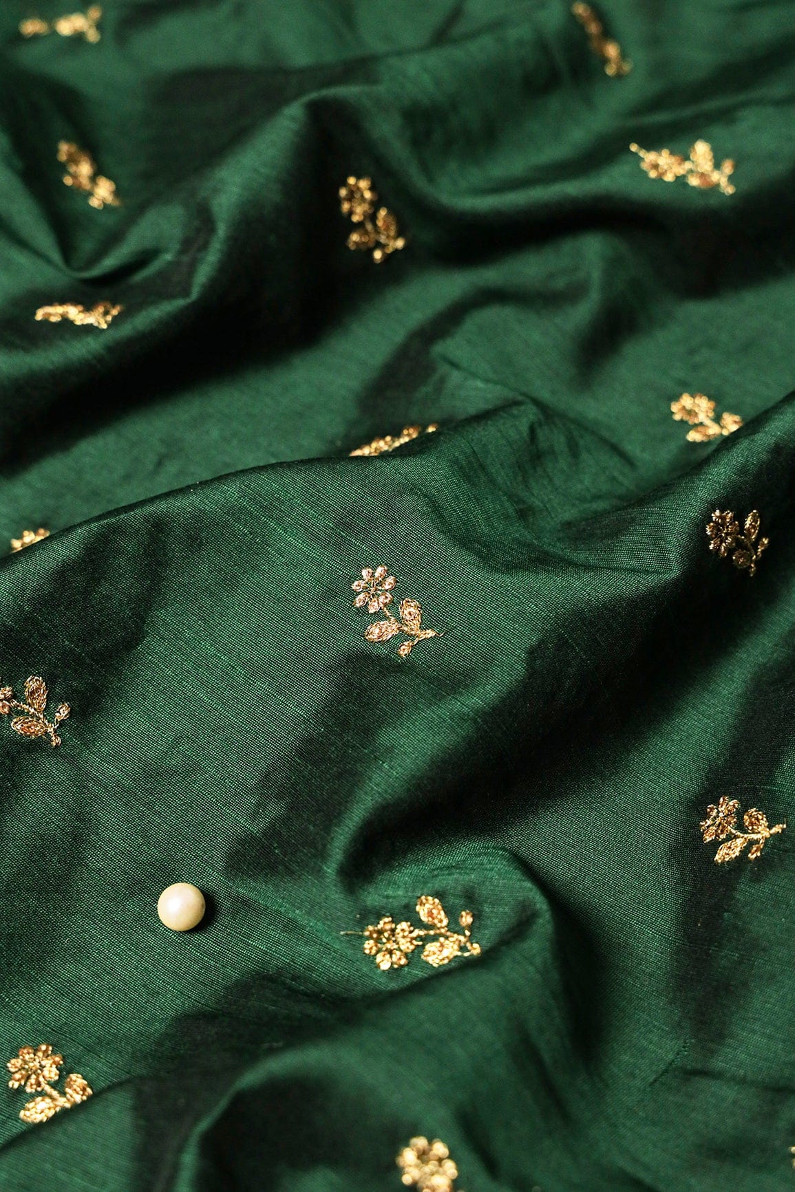 AIzaSyBcstauz-XMPRhEY21AUzeo032pxrXB5Ug - Gold Sequins With Gold Zari Small Floral Motif Embroidery Work On Bottle Green Raw Silk Fabric