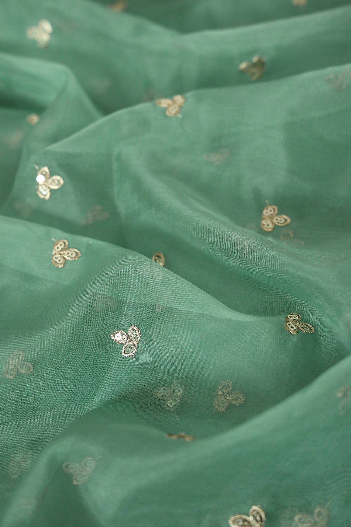 AIzaSyBcstauz-XMPRhEY21AUzeo032pxrXB5Ug - Gold Sequins With Gold Zari Small Leafy Motif Embroidery Work On Olive Organza Fabric