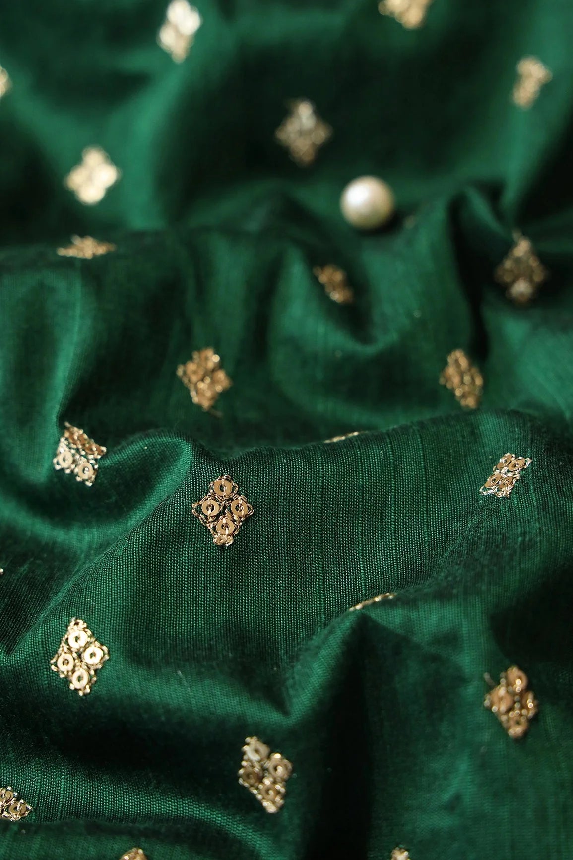 AIzaSyBcstauz-XMPRhEY21AUzeo032pxrXB5Ug - Gold Sequins With Gold Zari Small Motif Embroidery Work On Bottle Green Raw Silk Fabric
