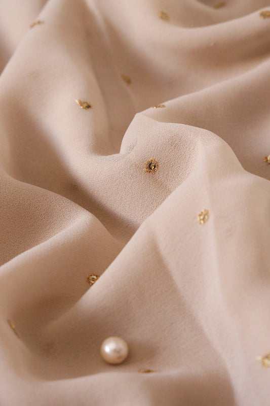 AIzaSyBcstauz-XMPRhEY21AUzeo032pxrXB5Ug - Gold Sequins With Gold Zari Small Motif Embroidery Work On Light Beige Georgette Fabric