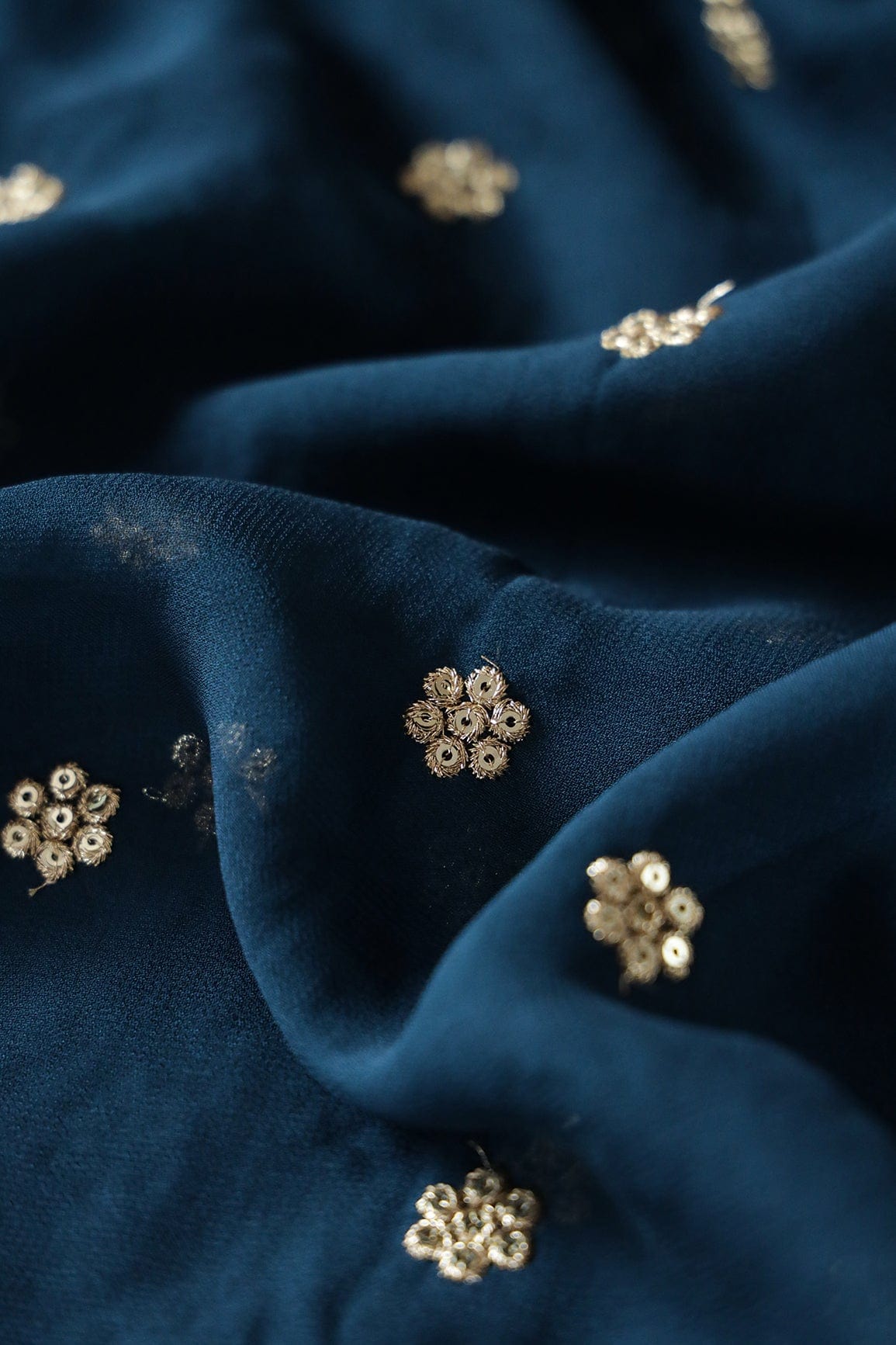 AIzaSyBcstauz-XMPRhEY21AUzeo032pxrXB5Ug - Gold Sequins With Gold Zari Small Motif Embroidery Work On Prussian Blue Georgette Fabric