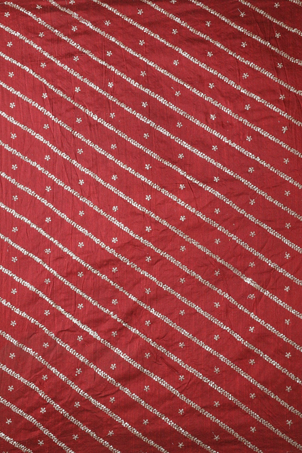 AIzaSyBcstauz-XMPRhEY21AUzeo032pxrXB5Ug - Gold Sequins With Gold Zari Stripes And Small Motif Embroidery Work On Maroon Raw Silk Fabric
