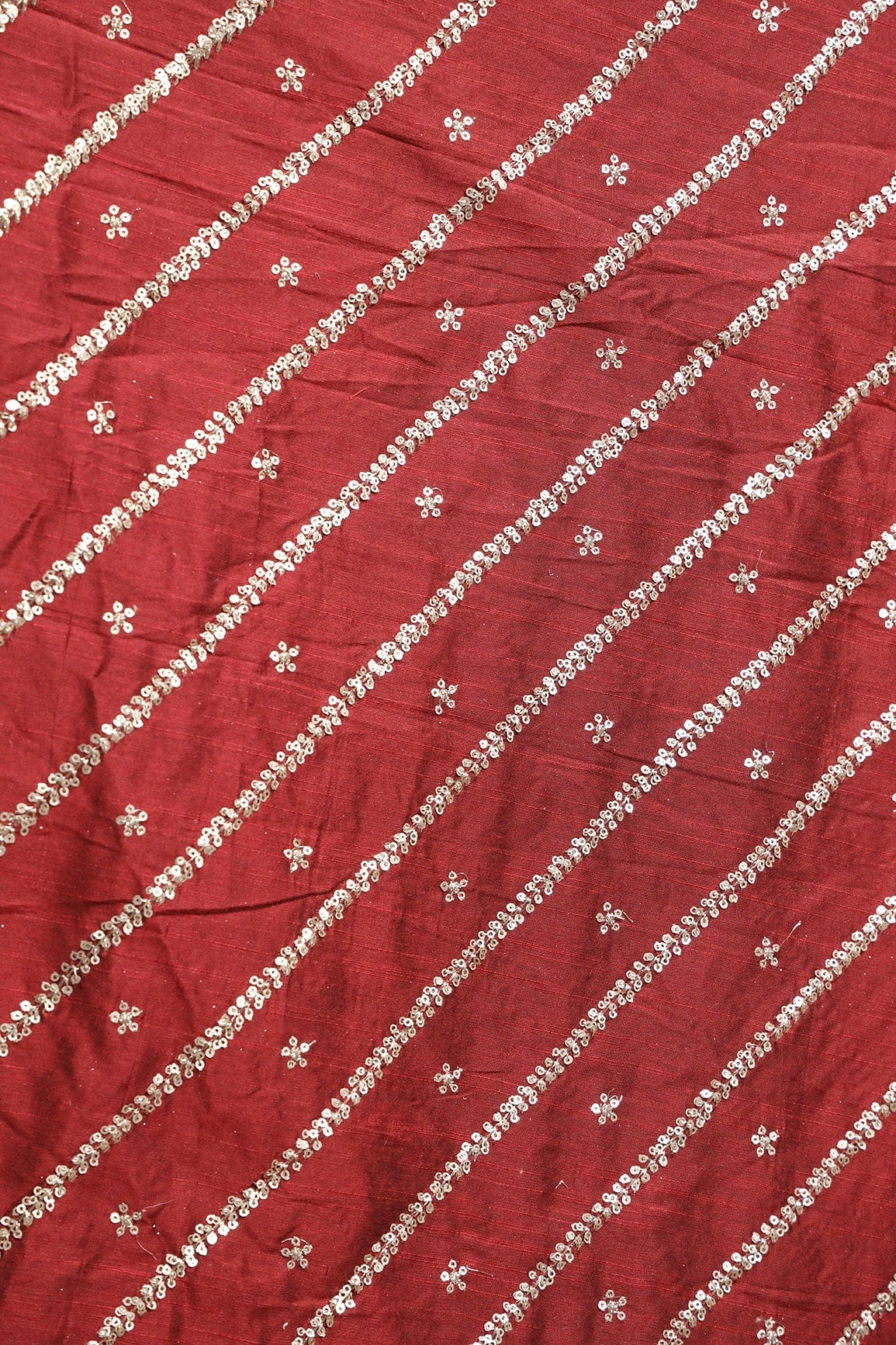 AIzaSyBcstauz-XMPRhEY21AUzeo032pxrXB5Ug - Gold Sequins With Gold Zari Stripes And Small Motif Embroidery Work On Maroon Raw Silk Fabric