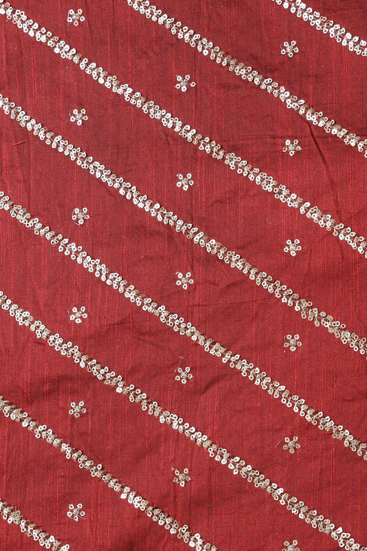 AIzaSyBcstauz-XMPRhEY21AUzeo032pxrXB5Ug - Gold Sequins With Gold Zari Stripes And Small Motif Embroidery Work On Maroon Raw Silk Fabric