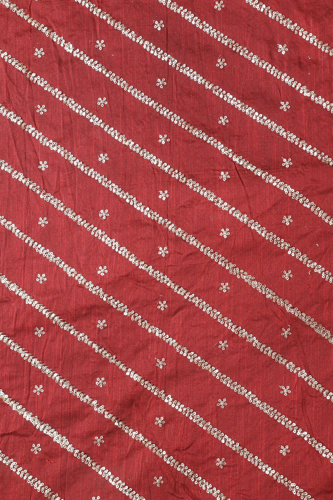AIzaSyBcstauz-XMPRhEY21AUzeo032pxrXB5Ug - Gold Sequins With Gold Zari Stripes And Small Motif Embroidery Work On Maroon Raw Silk Fabric