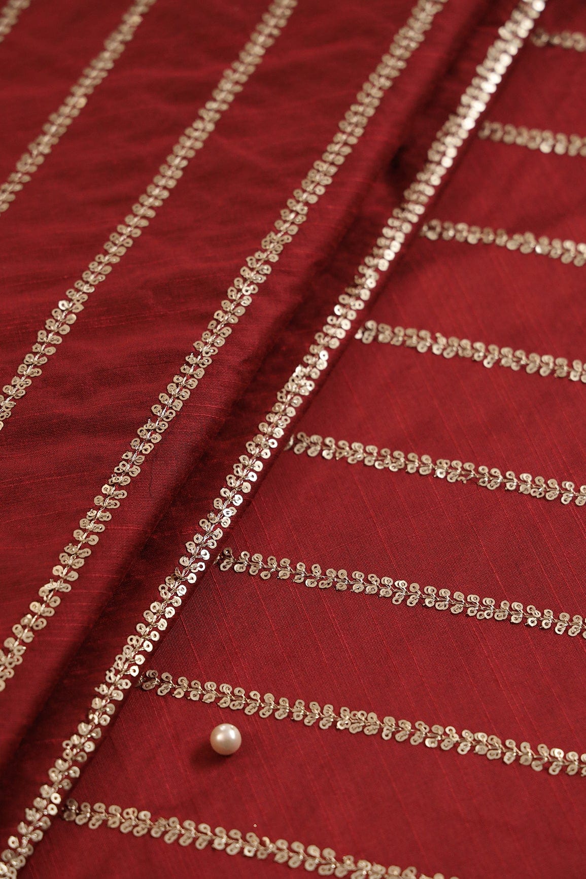 AIzaSyBcstauz-XMPRhEY21AUzeo032pxrXB5Ug - Gold Sequins With Gold Zari Stripes Embroidery Work On Maroon Raw Silk Fabric