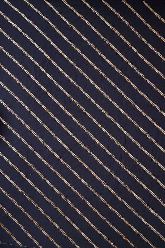 AIzaSyBcstauz-XMPRhEY21AUzeo032pxrXB5Ug - Gold Sequins With Gold Zari Stripes Embroidery Work On Navy Blue Raw Silk Fabric