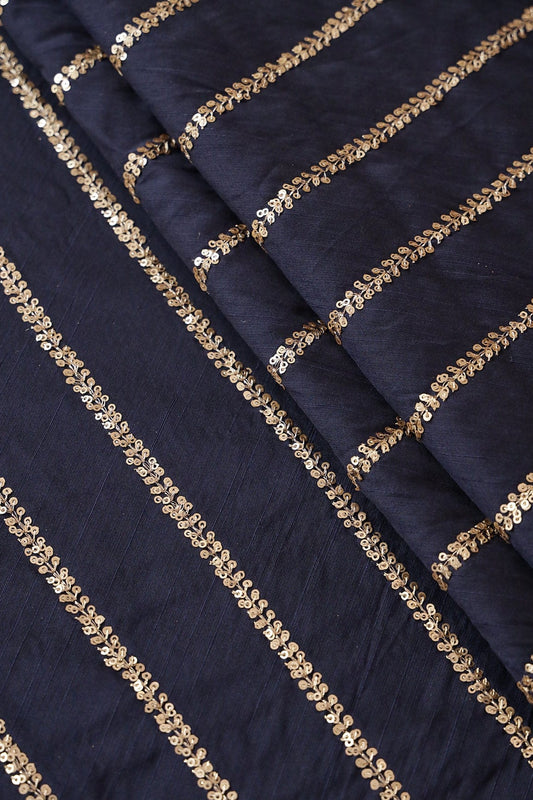 AIzaSyBcstauz-XMPRhEY21AUzeo032pxrXB5Ug - Gold Sequins With Gold Zari Stripes Embroidery Work On Navy Blue Raw Silk Fabric