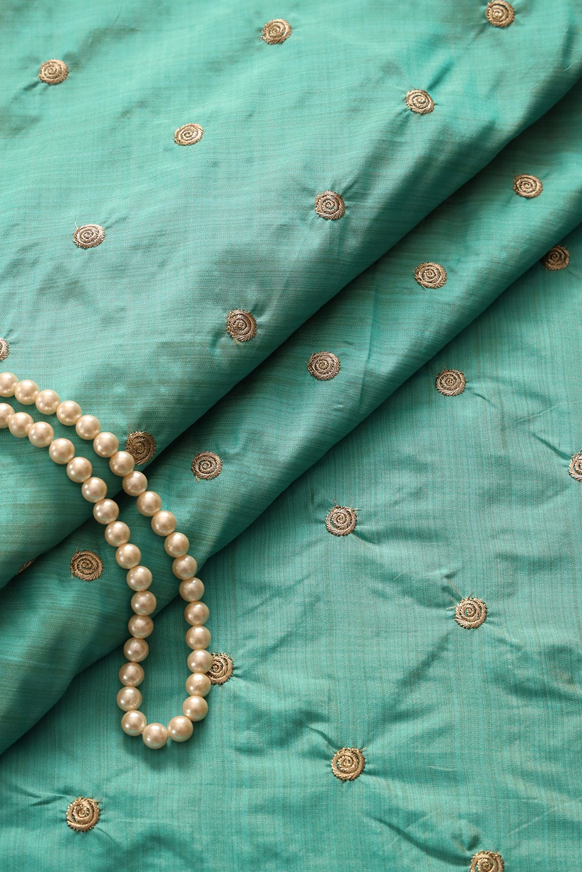 AIzaSyBcstauz-XMPRhEY21AUzeo032pxrXB5Ug - Gold Zari Small Motif Embroidery Work On Rama Bamboo Silk Fabric