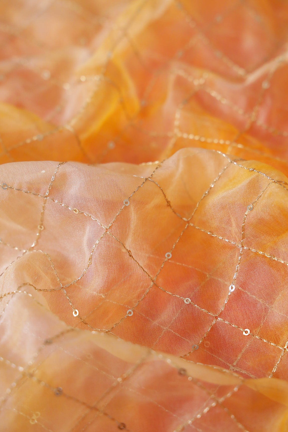 AIzaSyBcstauz-XMPRhEY21AUzeo032pxrXB5Ug - Gold Zari With Gold Sequins Checks Embroidery Work On Tie & Dye Orange And Yellow Organza Fabric