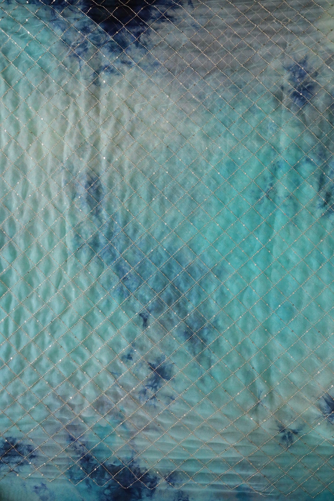 AIzaSyBcstauz-XMPRhEY21AUzeo032pxrXB5Ug - Gold Zari With Gold Sequins Checks Embroidery Work On Tie & Dye Turquoise And Blue Organza Fabric