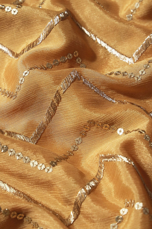 AIzaSyBcstauz-XMPRhEY21AUzeo032pxrXB5Ug - Gold Zari With Gold Sequins Chevron Embroidery Work On Beige Chinnon Chiffon Fabric