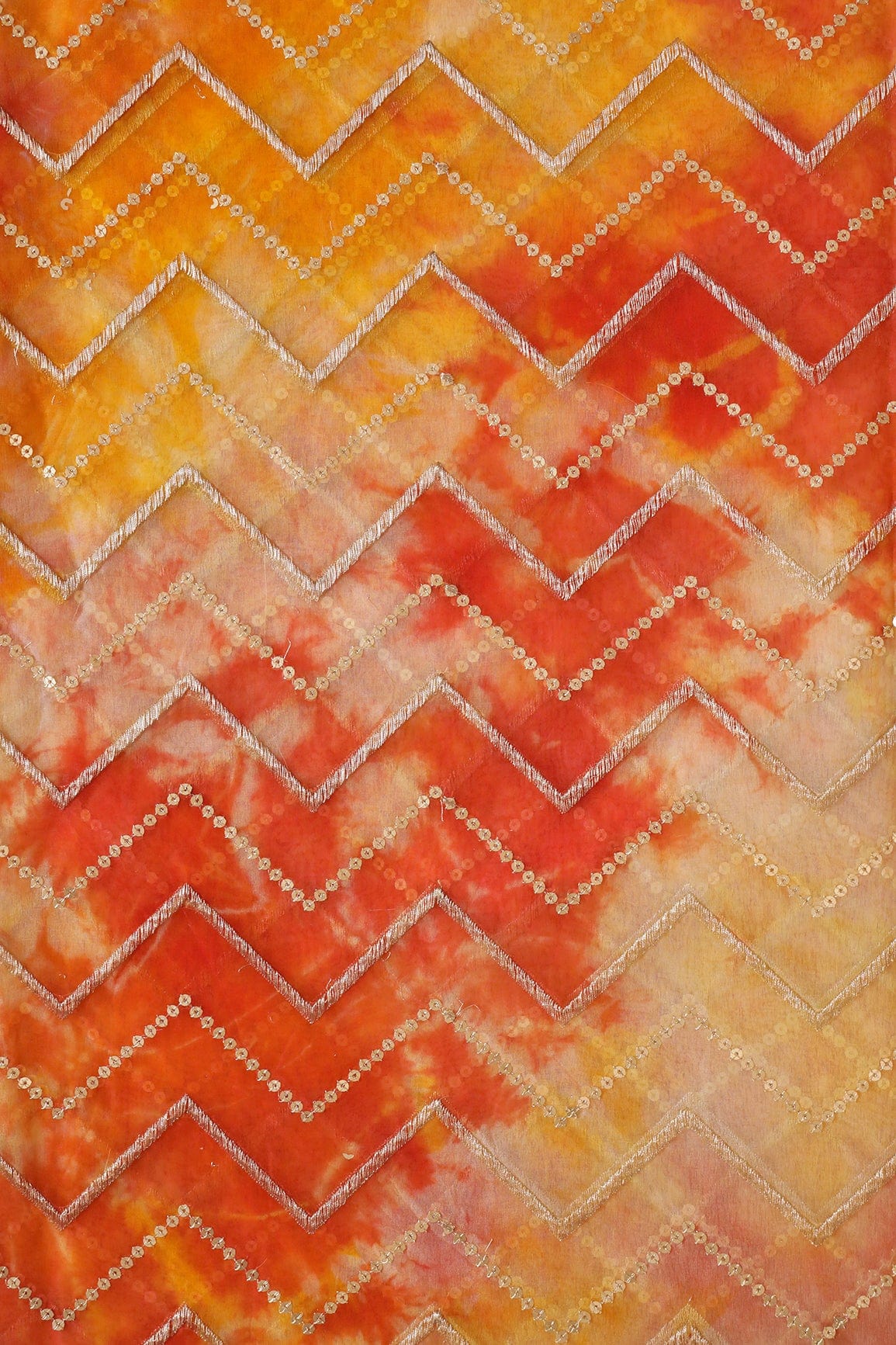 AIzaSyBcstauz-XMPRhEY21AUzeo032pxrXB5Ug - Gold Zari With Gold Sequins Chevron Embroidery Work On Tie & Dye Dark Orange And Yellow Organza Fabric