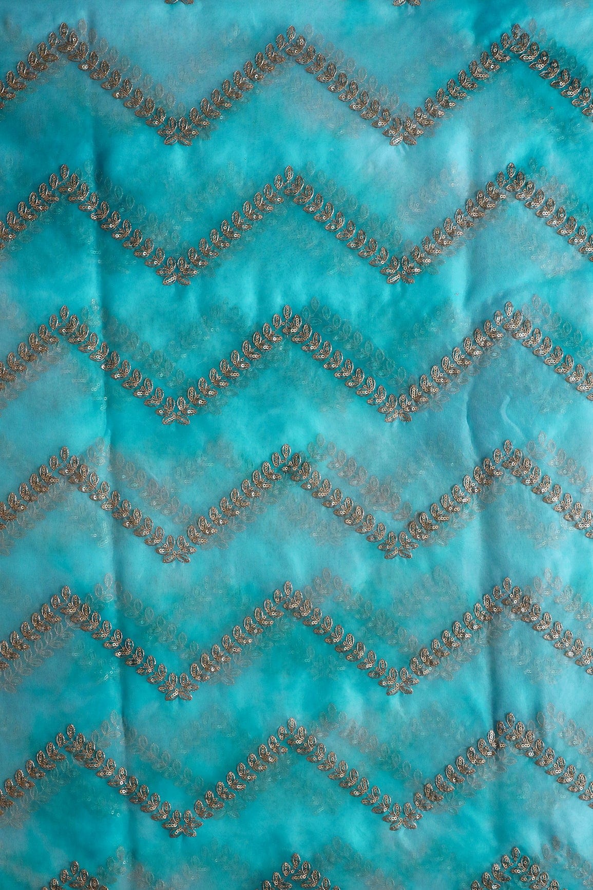 AIzaSyBcstauz-XMPRhEY21AUzeo032pxrXB5Ug - Gold Zari With Gold Sequins Chevron Embroidery Work On Tie & Dye Sky Blue Organza Fabric