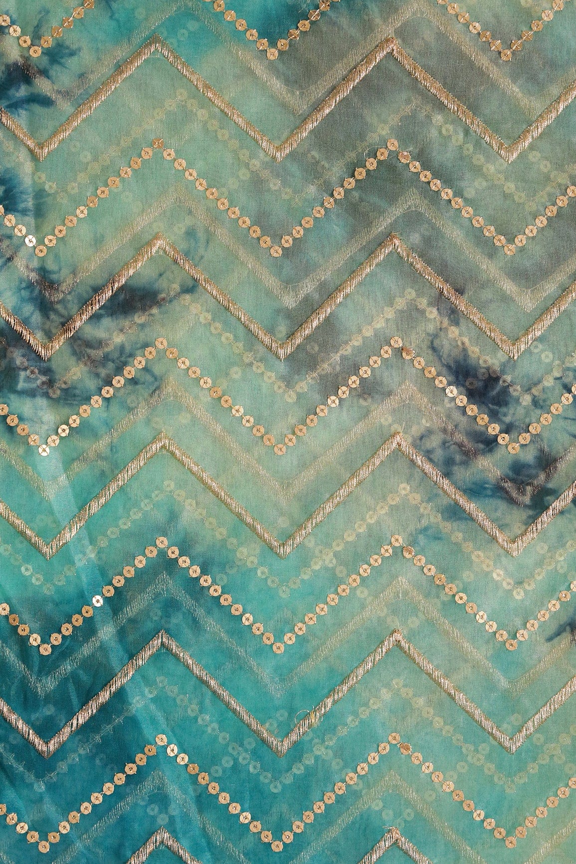 AIzaSyBcstauz-XMPRhEY21AUzeo032pxrXB5Ug - Gold Zari With Gold Sequins Chevron Embroidery Work On Tie & Dye Turquoise And Light Blue Organza Fabric