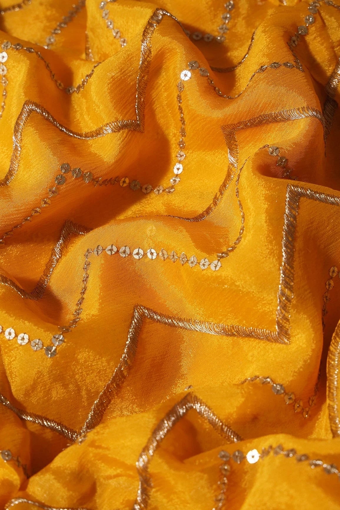 AIzaSyBcstauz-XMPRhEY21AUzeo032pxrXB5Ug - Gold Zari With Gold Sequins Chevron Embroidery Work On Yellow Chinnon Chiffon Fabric