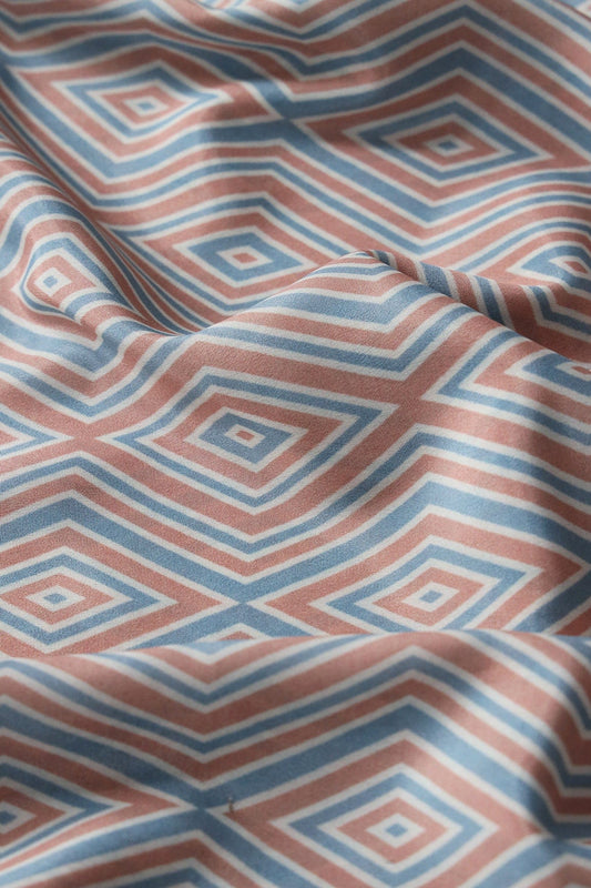 Light Peach And Pastel Blue Geometric Pattern Digital Print On French Crepe Fabric