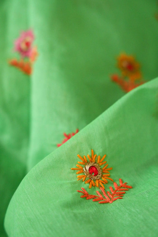 Multi Color Thread With Gold Zari Floral Embroidery Work On Green Chanderi Fabric