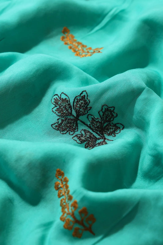 Multi Thread Floral Embroidery On Turquoise Muslin Silk Fabric