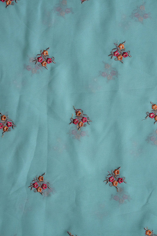 Orange And Dark Pink Thread With Sequins Floral Embroidery Work On Teal Georgette Fabric