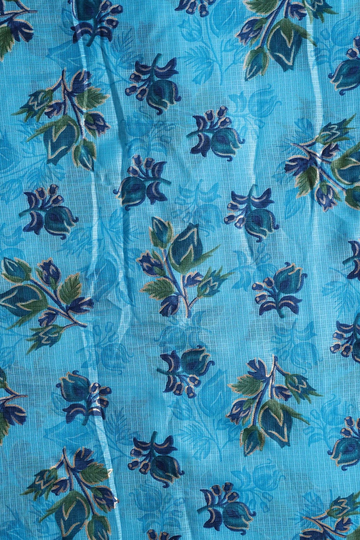 AIzaSyBcstauz-XMPRhEY21AUzeo032pxrXB5Ug - Blue And Green Floral Pattern Foil Print On Sky Blue Kota Doria Fabric