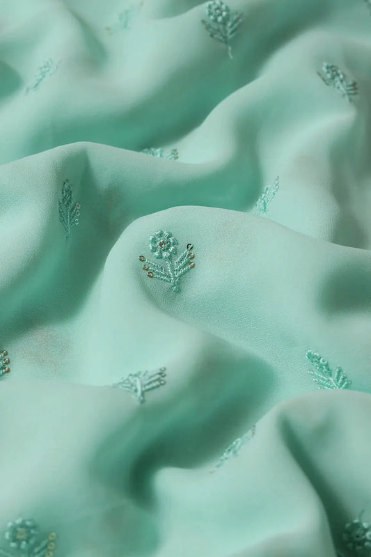 Turquoise Thread With Sequins Small Floral Embroidery Work On Pale Turquoise Georgette Fabric