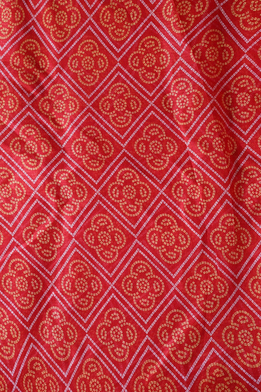 White And Yellow Bandhani Print On Red Kota Doria Fabric
