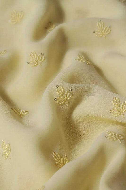 Yellow Thread With Sequins Small Leafy Embroidery Work On Light Yellow Georgette Fabric